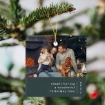 Minimal Christmas | Forest Green Family Photo Ceramic Ornament<br><div class="desc">A stylish modern holiday photo ornament with a classic typography quote "simply having a wonderful christmas time" with a dividing line and family name with a vertical text direction in white. The design has a dark forest green feature color and is in a 'scandi' scandinavian design style. The photo, greeting...</div>