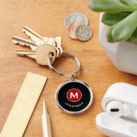 Minimal Classic Monogram Black Red Keychain<br><div class="desc">Minimal monogrammed round keychain feature a black background with your initial in a red monogram medallion with and name in classic block typography in white for a simple classic professional look.</div>