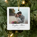 Minimal Elegant 1st Christmas Photo Christmas Ceramic Ornament<br><div class="desc">This minimal and elegant engagement photo Christmas ornament is the perfect way to commemorate your first Christmas as a soon to be married couple. The ornament features a simple, black and white design with your names and the date of your wedding. You can also add your photo to the ornament,...</div>