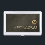 Minimal Luxury Black Gold Monogram Business Card Holder<br><div class="desc">Minimalist monogram design with brushed metallic gold monogram medallion with personalized name and title or custom text below in classic block typography on a textured background in shades of black chestnut brown. Personalize for your custom use.</div>