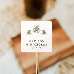 Minimal Palm Trees Personalized Wedding Square Sticker<br><div class="desc">Seal your wedding invitations and favours with these personalized palm tree stickers. The tropical wedding stickers feature three palm trees with your names and wedding date displayed below in black lettering on an ivory background. The palm tree wedding stickers were designed to coordinate with our Minimal Palm Tree wedding collection....</div>