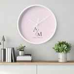 Minimal Pastel Pink Initial & Personalized  Clock<br><div class="desc">Add a touch of elegance to your space with this Minimal Pastel Pink Initial & Personalized Clock. Featuring a sleek and minimalist design, this clock is perfect for those who appreciate both functionality and style. The soft pastel pink background provides a sophisticated flair, while the personalized initial or name makes...</div>