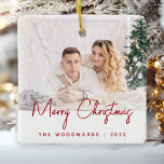 Minimal Photo Merry Christmas Red Script Ceramic Ornament<br><div class="desc">Wish family and friends as special Merry Christmas with this modern minimalist photo keepsake ornament. The red text reads "Merry Christmas" in trendy handwriting script. Easily replace the sample image with your favourite photo, and add your family name or first names and the year below. A white gradient screen helps...</div>