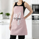 Minimal Pink Modern Typographic Monogram Apron<br><div class="desc">Enhance your cooking experience with the Minimal Pink Modern Typographic Monogram Apron. This sleek apron features a soft blush pink colour and a contemporary typographic monogram, offering a personalized touch to your kitchen attire. Made from high-quality, durable fabric, it provides excellent coverage and protection while cooking or baking. The adjustable...</div>