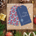 Minimal Poinsettia Blue Santa Merry Christmas Gift Tags<br><div class="desc">This simple and minimal design features my hand drawn pale blue poinsettia on a dark blue background on the front and a Santa and traditional red poinsettia pattern on the back for a classic vibe that evokes the nostalgia of Christmas past while the illustrated elements and script font give it...</div>