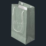 Minimal Sage Green Floral Bridal Shower Thank You Small Gift Bag<br><div class="desc">This bridal shower gift bag features soft sage green tones with delicate botanical linework for a calm, elegant look. The front design pairs graceful script lettering with personalized details, while the all-over floral pattern adds a thoughtful, cohesive finish. Personalize the name and date to match your celebration. Perfect for presenting...</div>