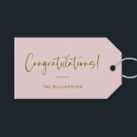 Minimalist Blush Pink Personalized Congratulations Gift Tags<br><div class="desc">A stylish and elegant gift tag featuring a soft blush pink background with flowing script and modern typography in warm gold. Perfect for adding a personal touch to wedding gifts, baby showers, graduations, or any celebratory occasion. Customize with your family name or message for a unique and thoughtful finishing touch....</div>