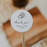 Minimalist Horseshoe | Black and White Wedding Classic Round Sticker<br><div class="desc">These trendy yet elegant, black and white wedding or bridal shower stickers feature a modern and minimalist rustic style, with handwritten script that says "thank you" as well as classic text. A hand-drawn pair of horseshoes is featured in a subtle illustration, for an updated look for your country, western or...</div>