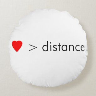 minimalist "love is greater than distance" quote round pillow