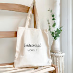 Minimalist Modern Script Bridesmaid Wedding Tote Bag<br><div class="desc">Celebrate your bridal party with our Modern Minimalist Script Bridesmaid Gift Tote Bags for Bachelorette Party. This typography design masterpiece gracefully blends an elegant script font with a timeless, understated san serif font. Ideal for bachelorette parties, bridal shower or wedding proposals, this tote bag can be personalized with their names,...</div>