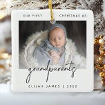 Minimalist Photo Grandparents 1st Christmas Gray Ceramic Ornament<br><div class="desc">Help them celebrate the arrival of their first grandchild with this modern minimalist photo keepsake ornament. The charcoal gray text reads "Our first Christmas as grandparents, " with the word "grandparents" in trendy handwriting script. Easily replace the sample image with your favorite photo of the new baby, and add his...</div>