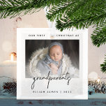 Minimalist Photo Grandparents 1st Christmas Gray Glass Ornament<br><div class="desc">Help them celebrate the arrival of their first grandchild with this modern minimalist photo keepsake ornament. The charcoal gray text reads "Our first Christmas as grandparents, " with the word "grandparents" in trendy handwriting script. Easily replace the sample image with your favorite photo of the new baby, and add his...</div>