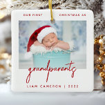 Minimalist Photo Grandparents 1st Christmas Red Ceramic Ornament<br><div class="desc">Help them celebrate the arrival of their first grandchild with this modern minimalist photo keepsake ornament. The red text reads "Our first Christmas as grandparents, " with the word "grandparents" in trendy handwriting script. Easily replace the sample image with your favorite photo, and add baby's name and the year below....</div>