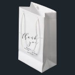 Minimalist White Black Bridal Shower Thank You Small Gift Bag<br><div class="desc">Make your bridal shower or special event extra memorable with this stylish personalized gift bag. Featuring a minimalist "thank you" in elegant script, this design blends modern sophistication with timeless charm. Perfect for bridal party gifts, wedding favours, or special thank-you treats, this customizable bag adds a thoughtful touch to any...</div>