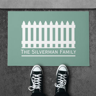 Minimalist White Picket Fence on Green Family Doormat