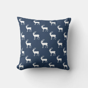 Minimalist white reindeer pattern on blue throw pillow