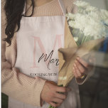 Minimalistic Monogram Initial & Name Pastel Pink Apron<br><div class="desc">Cook and bake in style with our Minimalistic Monogram Initial & Name Pastel Pink Apron. This elegant apron features a sleek design personalized with your initial and name, set against a soft pastel pink background. Made from high-quality, durable fabric, it offers excellent protection and comfort while you prepare your favourite...</div>