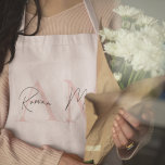 Minimalistic Monogram Initial & Name Pastel Pink Apron<br><div class="desc">Cook in style with our Minimalistic Monogram Personalized Pastel Pink Initial & Name Apron. This elegant apron features a soft pastel pink background with a custom monogram and name, adding a touch of sophistication to your kitchen attire. Made from high-quality, durable fabric, it offers both comfort and protection while cooking...</div>