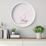 Minimalistic Monogram Initial & Name Pastel Pink  Clock<br><div class="desc">Add a touch of elegance to your home or office with our Minimalistic Monogram Initial & Name Pastel Pink Wall Clock. This chic clock features a sleek design personalized with your initial and name, making it a stylish and functional addition to any space. The soft pastel pink background adds a...</div>