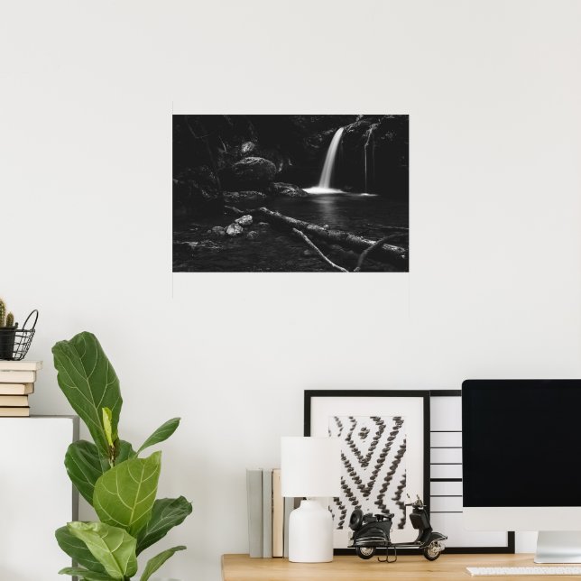 Minimalistic waterfall behind broken tree in black poster (Home Office)