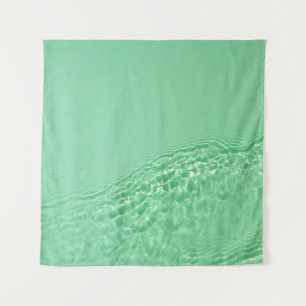 Mint blue coloured clear water surface texture wit tapestry