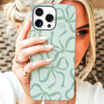 Mint Green Bow Monogram iPhone 16 Pro Max Case<br><div class="desc">Dress up your phone in style with this chic and trendy mint green phone case! Featuring a playful pattern of hand-drawn bows and personalized with your monogram, this case is the perfect blend of fashion and function. Made from durable materials to protect your phone from everyday bumps and scratches. A...</div>