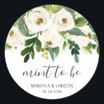 Mint To Be Elegant Greenery White Floral Wedding Classic Round Sticker<br><div class="desc">Floral wedding favor stickers with a top border featuring hand painted watercolor white roses and greenery with the message, "Mint to Be" in a lovely handwritten script and your names and date below. These elegant stickers are perfect for a garden wedding in the summer and are a great way to...</div>