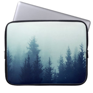 Misty fog in pine forest on mountain slopes. Color Laptop Sleeve