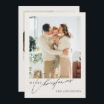 Modern 2-Photo Merry Christmas Holiday Card<br><div class="desc">This modern and elegant Christmas card design captures the warmth and joy of the holiday season with a large, full-bleed family photo on the front, complemented by a delicate script that reads "Merry Christmas" alongside the family name. The family photo sets a heartwarming mood, perfect for spreading festive cheer. The...</div>