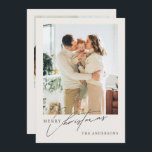 Modern 2-Photo Merry Christmas Holiday Card<br><div class="desc">This modern and elegant Christmas card design captures the warmth and joy of the holiday season with a large, full-bleed family photo on the front, complemented by a delicate script that reads "Merry Christmas" alongside the family name. The family photo sets a heartwarming mood, perfect for spreading festive cheer. The...</div>