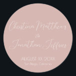 Modern and Elegant Dusty Pink Wedding Classic Round Sticker<br><div class="desc">This modern and elegant event or wedding sticker features a simple dusty pink background with white text. The names of the couple are printed in a script font. The wedding date and location are printed below.</div>