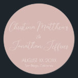 Modern and Elegant Dusty Pink Wedding Classic Round Sticker<br><div class="desc">This modern and elegant event or wedding sticker features a simple dusty pink background with white text. The names of the couple are printed in a script font. The wedding date and location are printed below.</div>