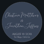 Modern and Elegant Navy Blue Wedding Classic Round Sticker<br><div class="desc">This modern and elegant event or wedding sticker features a simple navy blue background with white text. The names of the couple are printed in a script font. The wedding date and location are printed below.</div>