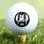 Modern Black 60th Birthday Golf Balls<br><div class="desc">Modern Black And White 60th Birthday Golf Ball Sticker. This round sticker features a bold design with a prominent "60" and "Sixty" at the top, styled for a fun and contemporary look. At the bottom, the birthday person’s initials are displayed in a simple sans serif font for a personalized touch....</div>
