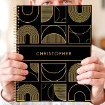 Modern Black and Gold Geometric Custom Name Planner<br><div class="desc">This modern planner design features a bold black background adorned with a sophisticated geometric pattern in radiant gold. The custom name showcased at the centre adds a sleek and personal touch to the overall design. Perfect for professionals, students, or anyone who values contemporary and luxurious aesthetics. Use it to organize...</div>
