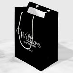 Modern Black and White Personalized Groomsman Medium Gift Bag<br><div class="desc">Modern Black and White Personalized Groomsman Gifts
featuring personalized groomsman's name in white modern script font style with title and wedding date in modern sans serif font style on black background.

Also perfect for best man,  father of the bride,  bridesmaid,  maid of honour,  mother of the bride and more.</div>