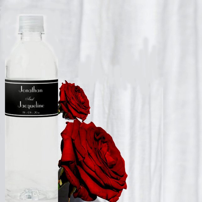 Modern Black And White Wedding Water Bottle Labels (Simple modern black and white, chic script elegant wedding water bottle labels with names.)