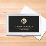 Modern Black Brushed Metallic Gold Monogram Business Card Holder<br><div class="desc">Elevate your professional look with this stylish and practical business card case. Featuring a brushed monogram medallion with your name company and title in classic block typography, this case is a great way to keep your business cards organized and protected. The black background adds a touch of sophistication, while the...</div>