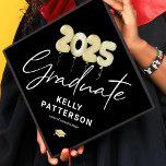 Modern Black Gold Balloons 2025 Graduation Cap Topper<br><div class="desc">Modern graduation cap topper featuring a trendy black background that can be changed to any colour,  watercolor gold 2025 balloons,  their name,  and the high school or college they attended.</div>