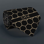 Modern Black Gold Foil Geometric Monogram Tie<br><div class="desc">Modern Black and Gold Foil Geometric Monogram Necktie in a stylish pattern of gold hexagons on an elegant black background. Easy to customize with text, fonts, and colours. Created by Zazzle pro designer BK Thompson © exclusively for Cedar and String; please contact us at cedarandstring@gmail.com if you need assistance, have...</div>