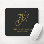 Modern Black Gold Monogram Mouse Pad<br><div class="desc">Keep your workspace stylish and functional with this Modern Black Gold Monogram Mouse Pad. The sleek design features a customizable monogram with name and title on a black background, and the non-slip rubber base ensures a secure grip on any surface. Perfect for both personal and professional use, this mouse pad...</div>