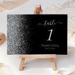 Modern Black Silver Glitter Edge Wedding Table Number<br><div class="desc">The left-hand edge of this elegant modern wedding table number features a silver faux glitter design. The customizable text combines silver grey handwriting,  copperplate and italic fonts on a black background.</div>