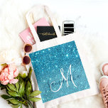 Modern Blue Glitter Sparkles Personalized Name Tote Bag<br><div class="desc">Introducing our Modern Blue Glitter Sparkles Personalized Name collection, exclusively available on Zazzle! This dazzling product line is perfect for adding a touch of glamor and customization to your everyday essentials. Embrace the modern and glamorous vibes of our Modern Blue Glitter Sparkles Personalized Name collection, available exclusively on Zazzle. With...</div>