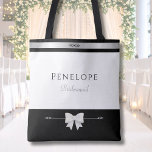 Modern Bridesmaid Gift | Luxury Typography Tote Bag<br><div class="desc">Gift your "I Do" crew a touch of designer luxury. This personalized bridesmaid tote bag features clean lines, a sophisticated silver-tone accent, and a professional serif typography layout. The high-contrast black and white palette ensures it matches any wedding theme, from a ballroom gala to a garden party. This custom name...</div>