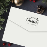 Modern Brush Merry Christmas Holly Family Self-inking Stamp<br><div class="desc">This modern self-inking rubber stamp features "Merry Christmas" with "Christmas" in bold brush calligraphy, accented with a charming holly sprig and finished with your family name in clean uppercase typography. Designed to add a festive touch to holiday cards, gift tags, and wrapped presents. A stylish seasonal tool for families celebrating...</div>