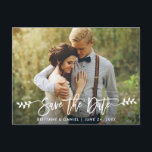 Modern Brush Script Leaves Photo Save The Date Postcard<br><div class="desc">Modern Brush Script Save The Date Engagement Couple Photo Postcard - White Script with Leaves</div>