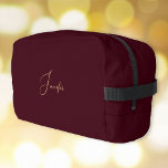 Modern Burgundy Gold Monogram Gym Travel Cosmetic Dopp Kit<br><div class="desc">Create your own custom, personalized, beautiful modern elegant faux gold script / typography monogram monogrammed, durable Polyester Poplin, sturdy polyester fabric mens womens kids solid plain dark burgundy brown cosmetic makeup toiletry organizer golf beach accessory gym travel dopp kit bag pouch with a zippered closure, two interior mesh pockets -...</div>