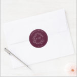 Modern Burgundy Leafy Crest Monogram Wedding Classic Round Sticker<br><div class="desc">A refined finishing touch for your wedding stationery, this elegant monogram seal sets the tone for a celebration of distinction. Featuring a delicate crest of botanical flourishes encircling your initials, it adds an air of sophistication to invitations, save-the-dates, and thank-you cards. The rich burgundy hue evokes timeless elegance, seamlessly complementing...</div>