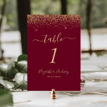 Modern Burgundy Red Gold Glitter Edge Wedding Table Number<br><div class="desc">The top edge of this elegant modern wedding table number features a gold faux glitter design. The customizable text combines pale gold-coloured handwriting,  copperplate and italic fonts on a burgundy red background.</div>
