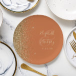 Modern Burnt Orange Gold Glitter Edge Wedding Paper Plate<br><div class="desc">The left-hand edge of these elegant modern wedding paper plates features a gold faux glitter design. Personalize them with the names of the bride and groom in pale gold-coloured handwriting script over a large ampersand on a burnt orange background,  with the wedding date below.</div>